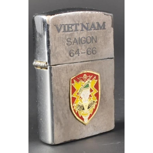 68 - A Vietnam War period US United States Special Forces cigarette lighter. The Zippo made windproof lig... 