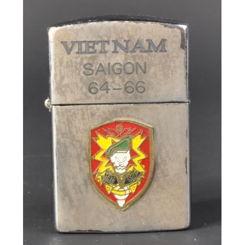 68 - A Vietnam War period US United States Special Forces cigarette lighter. The Zippo made windproof lig... 