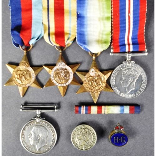 74 - A collection of assorted First and Second World War medals / militaria items comprising; WWI First W... 