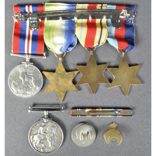 74 - A collection of assorted First and Second World War medals / militaria items comprising; WWI First W... 