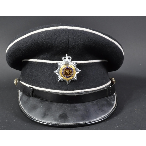 84 - A post war vintage Royal Army Service Corps officers dress uniform peaked cap. Dark blue twilled woo... 