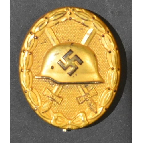 85 - A WWII Second World War Third Reich Nazi German Wound Badge. A gilded gold example for five or more ... 