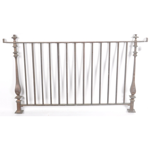 102 - An early 20th Century bronze bank teller window grill / gate having two turned supports with finials... 