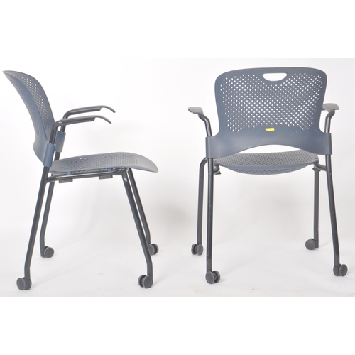 108 - Herman Miller - Caper - A set of four contemporary stacking office desk chairs with each bearing arm... 