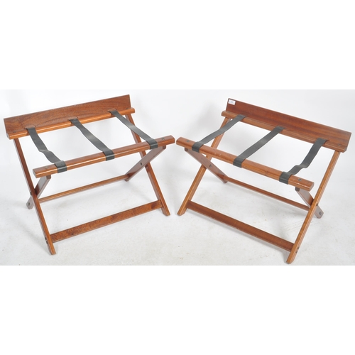 109 - Craster - A matching pair of Contemporary mahogany hotel folding luggage stands. Each with raised ba... 