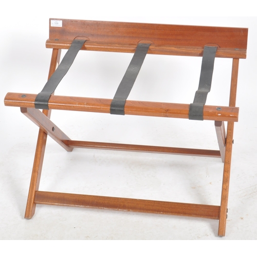 109 - Craster - A matching pair of Contemporary mahogany hotel folding luggage stands. Each with raised ba... 