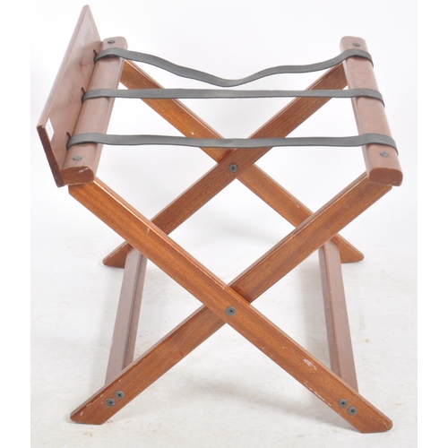 109 - Craster - A matching pair of Contemporary mahogany hotel folding luggage stands. Each with raised ba... 