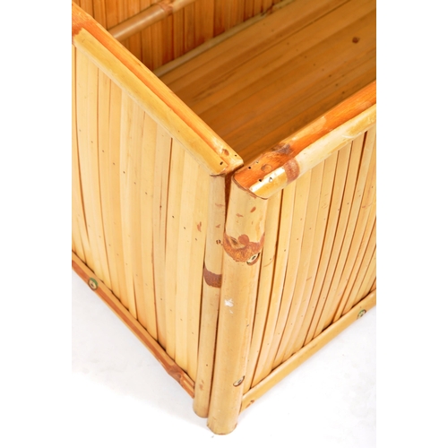 114 - A retro vintage 20th Century bamboo clad and framed blanket box / ottoman having a hinged lid openin... 