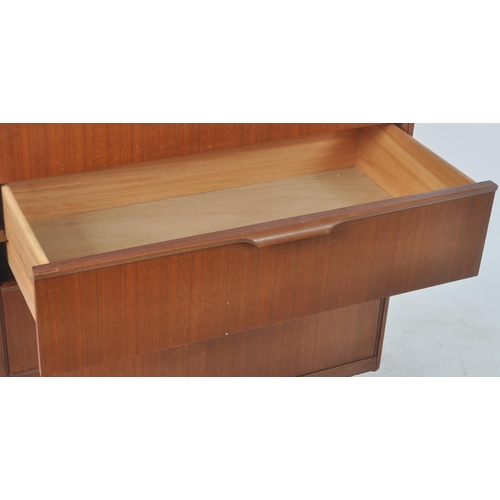 116 - Frank Guille for Austinsuite - A retro mid Century teak chest of drawers having a bank of four drawe... 