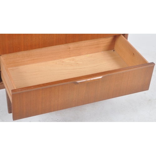 116 - Frank Guille for Austinsuite - A retro mid Century teak chest of drawers having a bank of four drawe... 