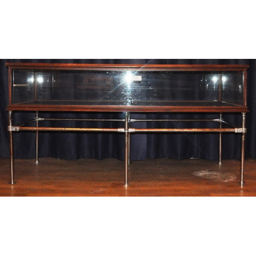 125 - A large 20th Century stained pine framed and glass paneled shop display cabinet / counter of large r... 