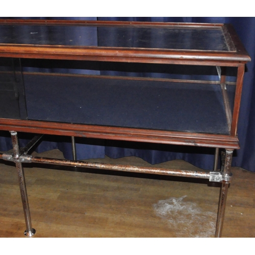 125 - A large 20th Century stained pine framed and glass paneled shop display cabinet / counter of large r... 