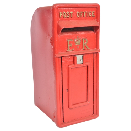 128 - A contemporary replica Royal Mail post office / wall post box having a hooded flap set above a hinge... 