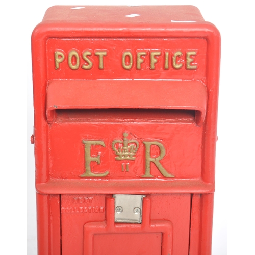 128 - A contemporary replica Royal Mail post office / wall post box having a hooded flap set above a hinge... 