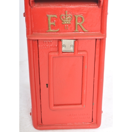 128 - A contemporary replica Royal Mail post office / wall post box having a hooded flap set above a hinge... 