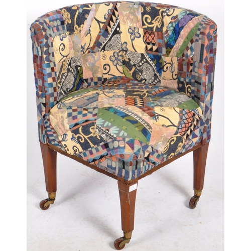 129 - A 19th Century Victorian corner armchair / chair having patterned patchwork upholstery to the curved... 