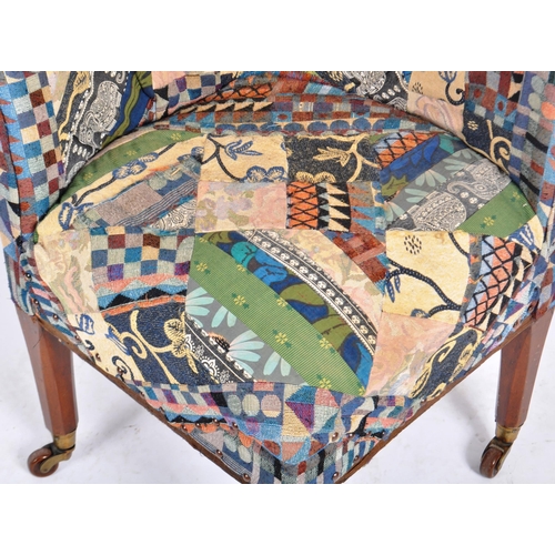 129 - A 19th Century Victorian corner armchair / chair having patterned patchwork upholstery to the curved... 