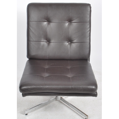 142 - A contemporary dark brown leather swivel lounge chair / lobby chair having removable button backed s... 