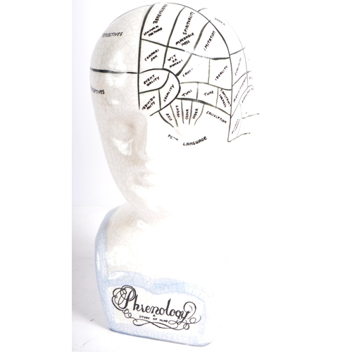 165 - A Victorian manner painted phrenology head in the manner of Fowler. Typical form with painted detail... 