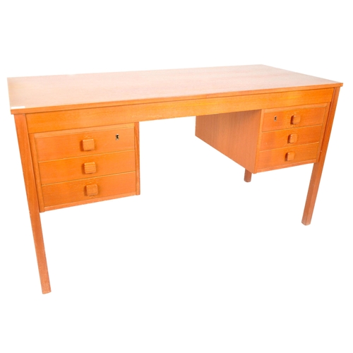 18 - Domino Mobler - A retro mid Century Danish teak office desk having two bank of three drawers flankin... 