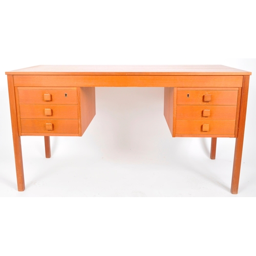 18 - Domino Mobler - A retro mid Century Danish teak office desk having two bank of three drawers flankin... 