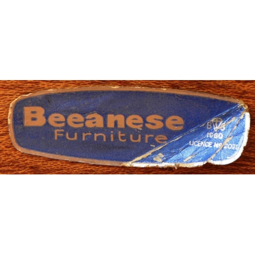 182 - Bceanese - A retro 20th Century teak chest of drawers of upright pedestal form having graduating ban... 