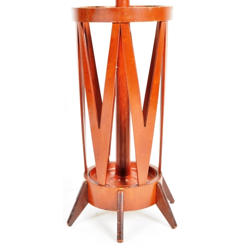 185 - Waring & Gillows - A mid 20th Century teak wood hat and umbrella stand. The lower section of barrel ... 