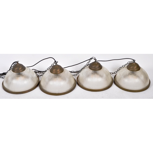 20 - A matching set of four early 20th Century holophane glass and brass hanging fly catcher ceiling ligh... 