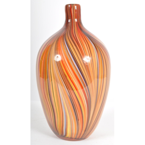 203 - A contemporary retro style designer glass vase of bulbous tapering form having a slender neck with m... 