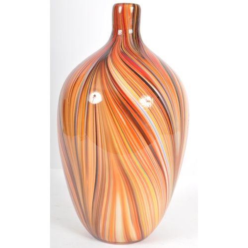 203 - A contemporary retro style designer glass vase of bulbous tapering form having a slender neck with m... 