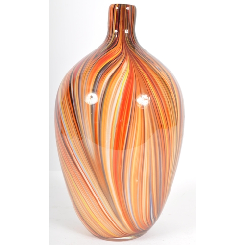 203 - A contemporary retro style designer glass vase of bulbous tapering form having a slender neck with m... 