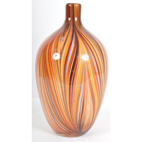 203 - A contemporary retro style designer glass vase of bulbous tapering form having a slender neck with m... 