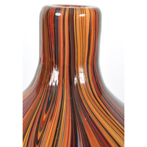 203 - A contemporary retro style designer glass vase of bulbous tapering form having a slender neck with m... 