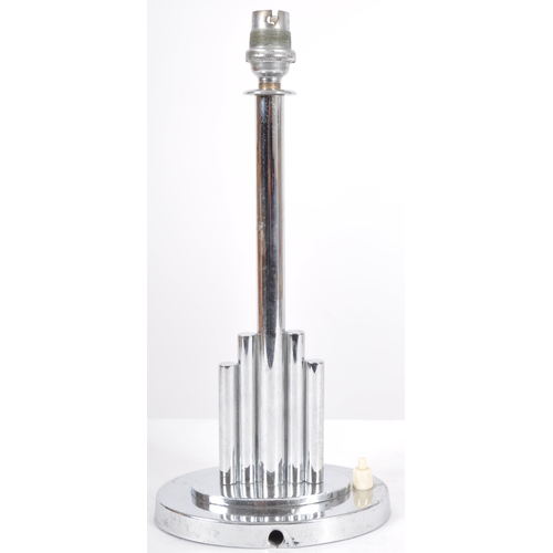 210 - A vintage 20th Century Art Deco chrome table lamp light having a central cylindrical stem flanked by... 