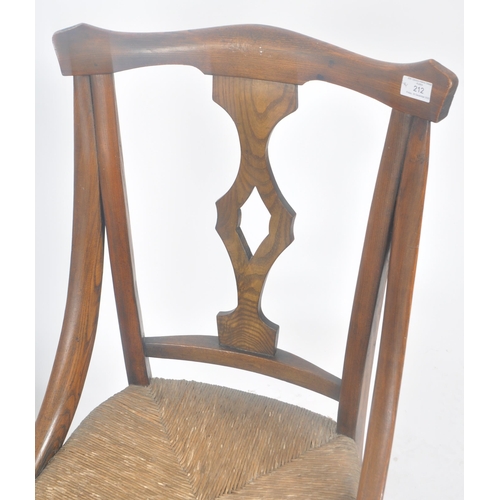 212 - A matching pair of late 19th Century Arts & Crafts oak chairs having yoke backrest tops with central... 