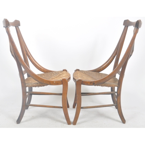 212 - A matching pair of late 19th Century Arts & Crafts oak chairs having yoke backrest tops with central... 