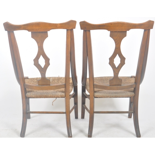 212 - A matching pair of late 19th Century Arts & Crafts oak chairs having yoke backrest tops with central... 