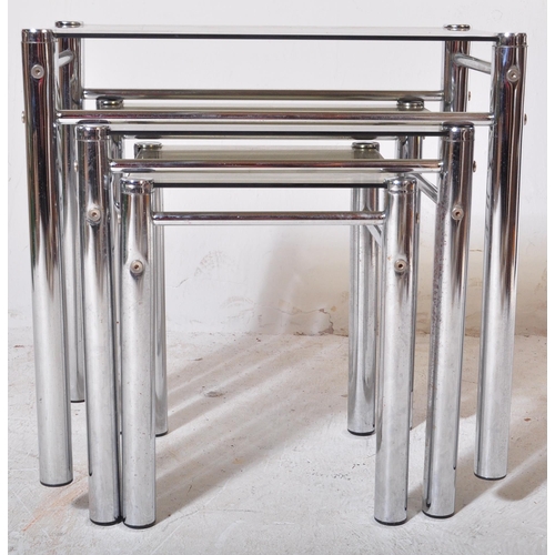 218 - A retro 20th Century 1970s chrome and smoked glass nest of tables. Each nesting table having thick c... 