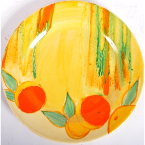 219 - Clarice Cliff - Two vintage 20th Century 1930s Art Deco hand painted plates. One plate decorated in ... 