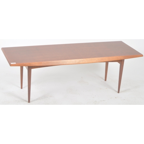 232 - Gordon Russell - A retro mid 20th Century designer teak Long John coffee table / low table raised on... 