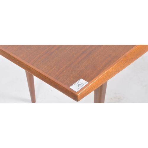 232 - Gordon Russell - A retro mid 20th Century designer teak Long John coffee table / low table raised on... 