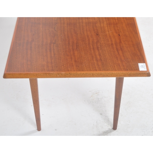 232 - Gordon Russell - A retro mid 20th Century designer teak Long John coffee table / low table raised on... 