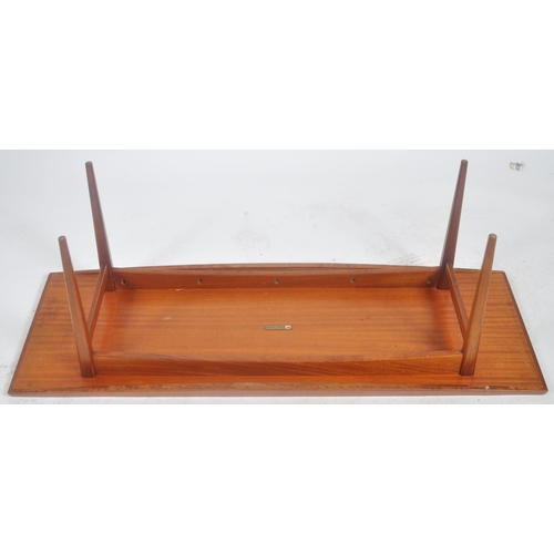 232 - Gordon Russell - A retro mid 20th Century designer teak Long John coffee table / low table raised on... 