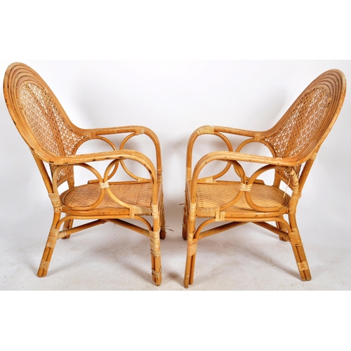 234 - A matching pair of retro 20th Century bamboo armchairs and matching side table / coffee table. Each ... 