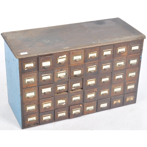 240 - An early 20th Century multi drawer pigeon hole cabinet / industrial filling chest having five rows o... 