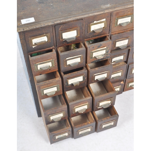 240 - An early 20th Century multi drawer pigeon hole cabinet / industrial filling chest having five rows o... 