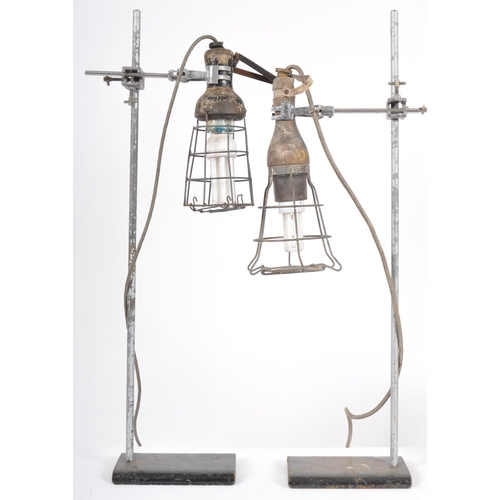 247 - A pair of retro vintage mid 20th Century industrial inspection lamp lights with each having wooden h... 