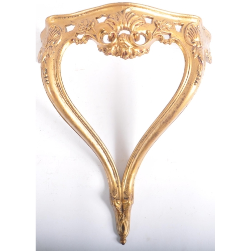 249 - A vintage mid Century Italian gilt framed mirror and wall mountable bracket. The mirror of decorativ... 