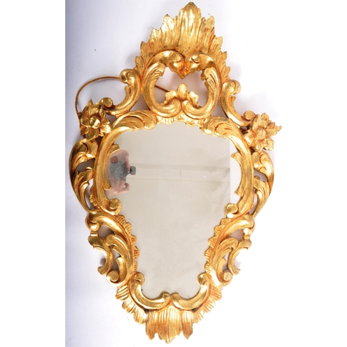 249 - A vintage mid Century Italian gilt framed mirror and wall mountable bracket. The mirror of decorativ... 