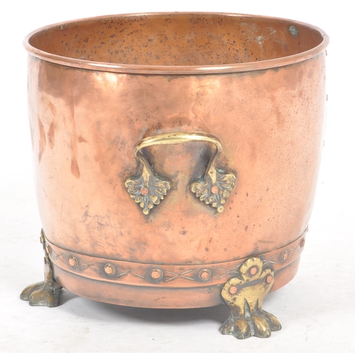 254 - A late 19th Century Victorian copper and brass planter of tapering barrel form with brass handles an... 